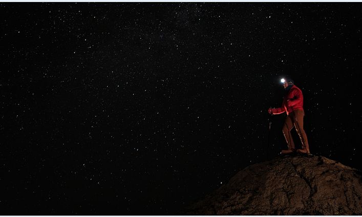 Man on a mountain in the dark