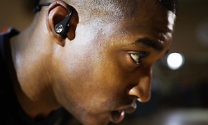 Man working out with in-ear headset