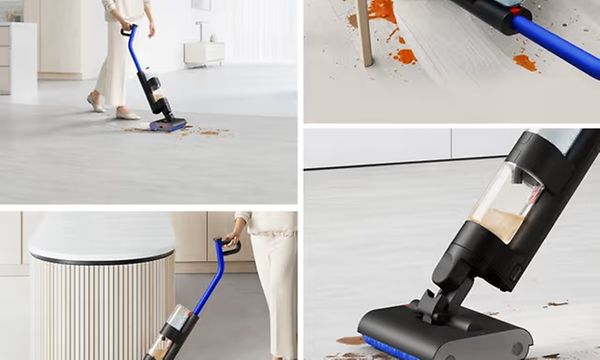Dyson G1 robot vacuum in silver with a sleek, circular design on a white background.