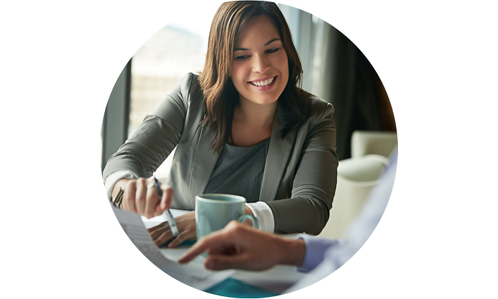 Smiling woman talking to a colleague in a meeting 